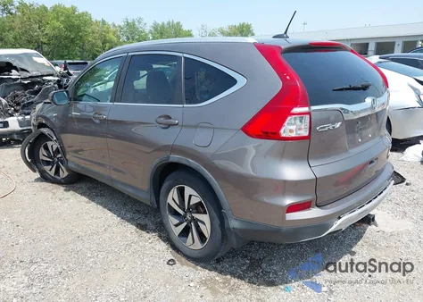 2015 Honda Cr-V Touring z USA, uszkodzony, nr VIN 5J6RM4H98FL126114